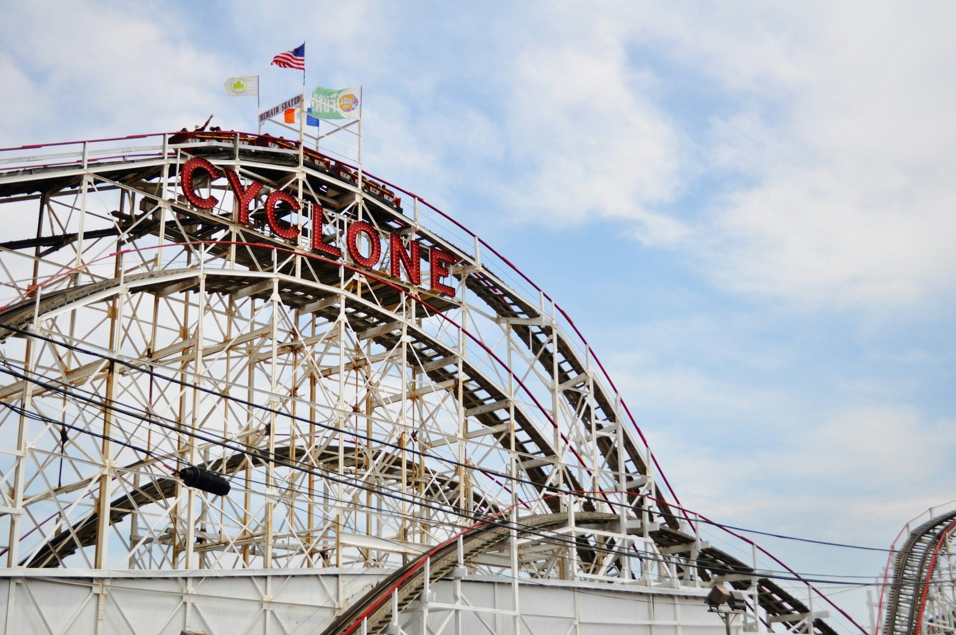 Coney Island Cyclone, Brooklyn | Pinpoint The Cyclone roller coaster with its red sign in Coney Island, Brooklyn.
